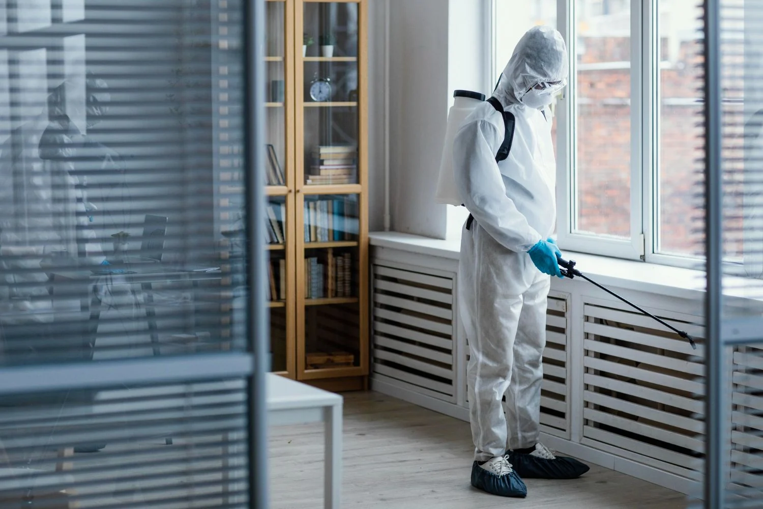 Sukhmani Pest Control technician spraying indoors